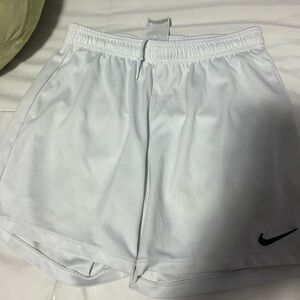 White Nike shorts